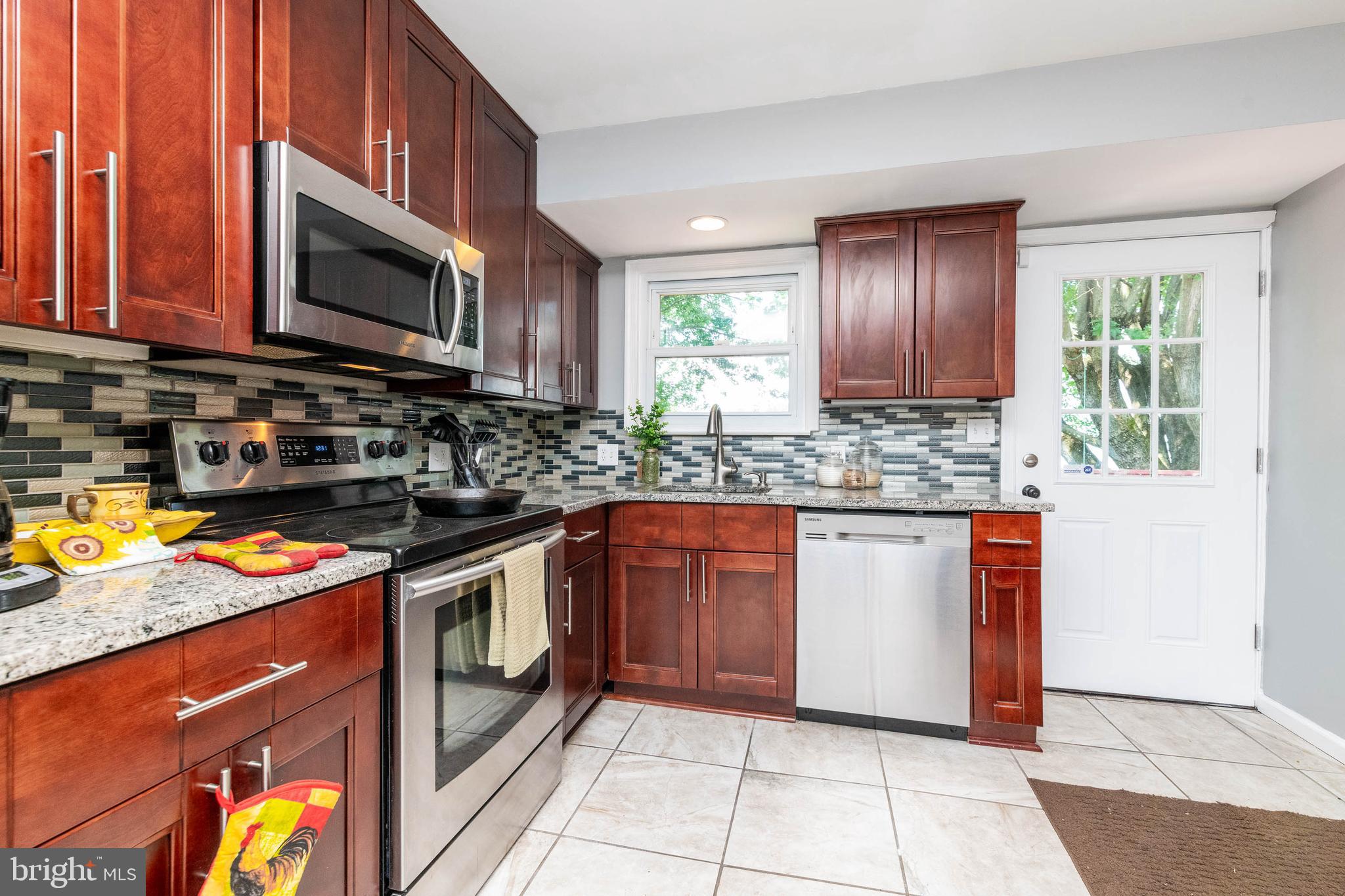 3728 Live Oak Road Randallstown, MD 21133 - Photo 10 of 27 Renovated spacious kitchen w/ door to rear deck