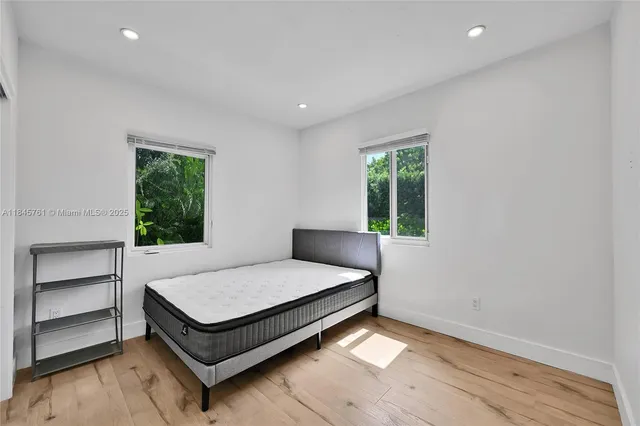 a room with a bed and a window