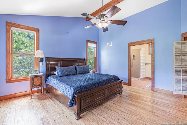 a bedroom with a bed and window