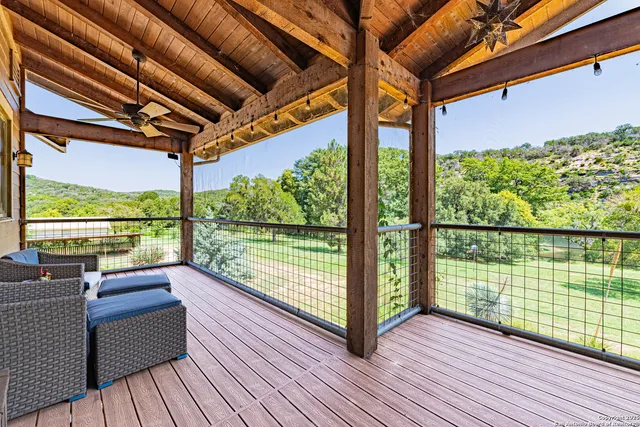 a view of balcony with wooden floor
