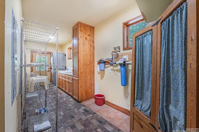 a bathroom with a sink and mirror