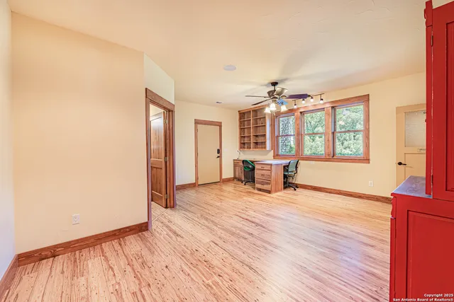 a view of a livingroom with furniture window and wooden floor