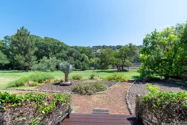 a front view of a building with garden