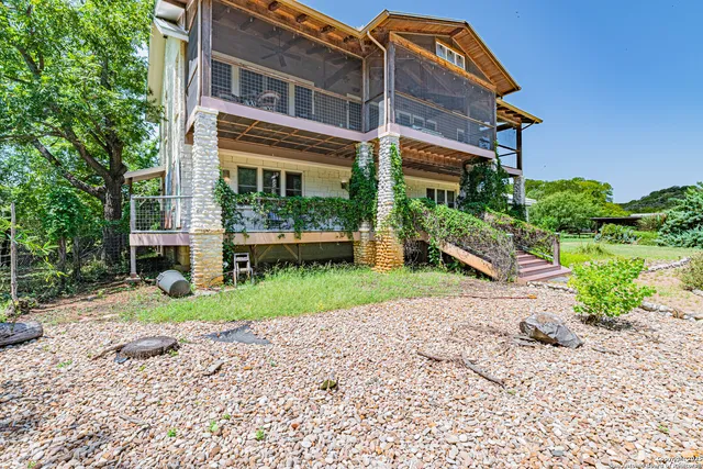 a view of backyard with large trees