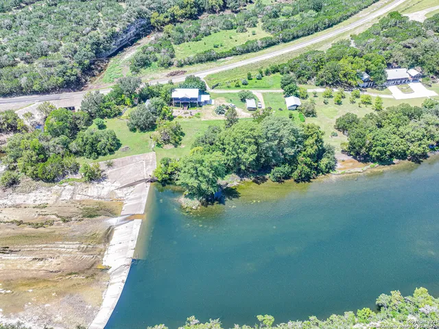 a view of a lake with a yard