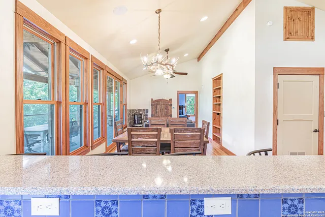 a living room with granite countertop furniture and fireplace
