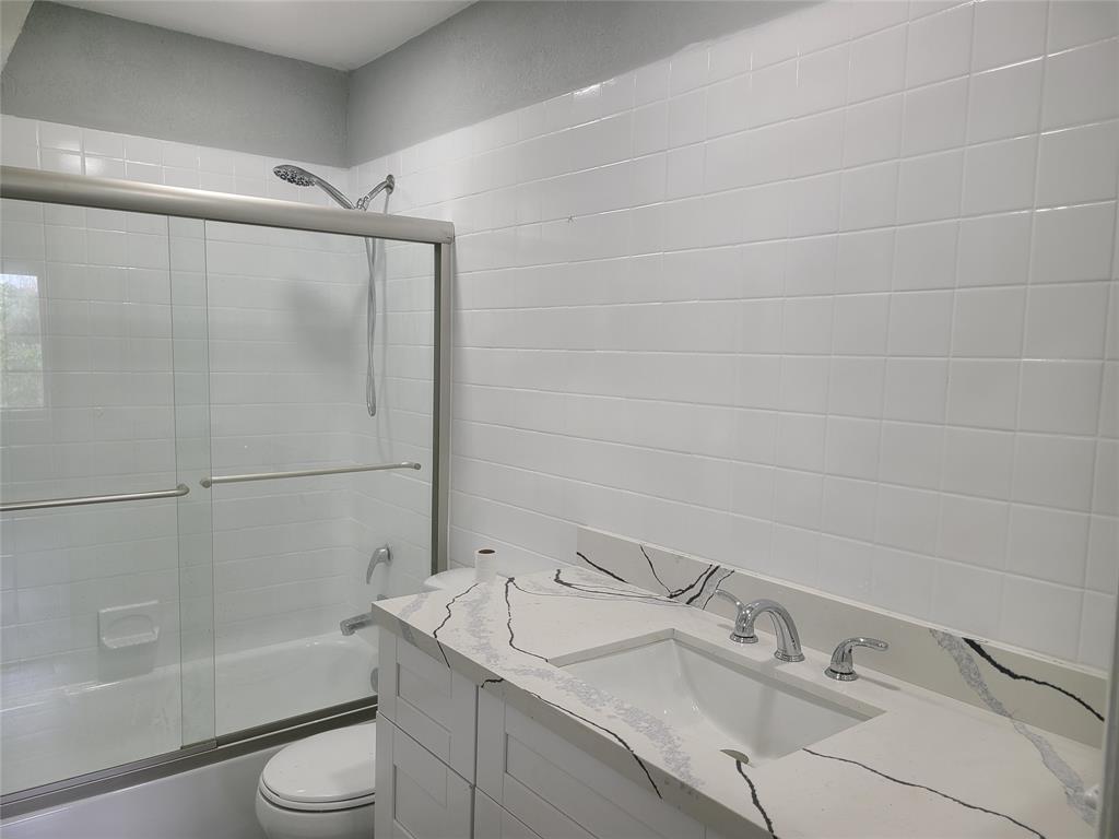 2775 Northwest 194th Terrace Miami Gardens, FL 33056 - Photo 13 of 37 a bathroom with a sink toilet and shower