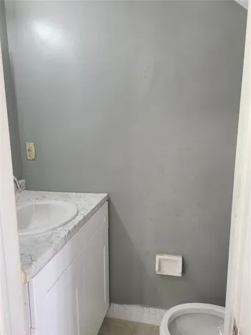 a bathroom with a sink and toilet