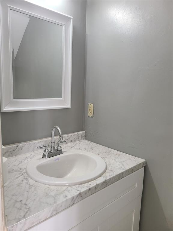 2775 Northwest 194th Terrace Miami Gardens, FL 33056 - Photo 22 of 37 a bathroom with a sink and a mirror