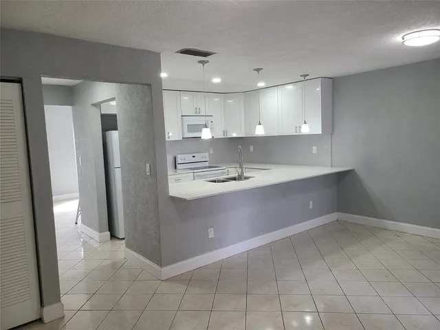 a bathroom with a sink a mirror and a shower