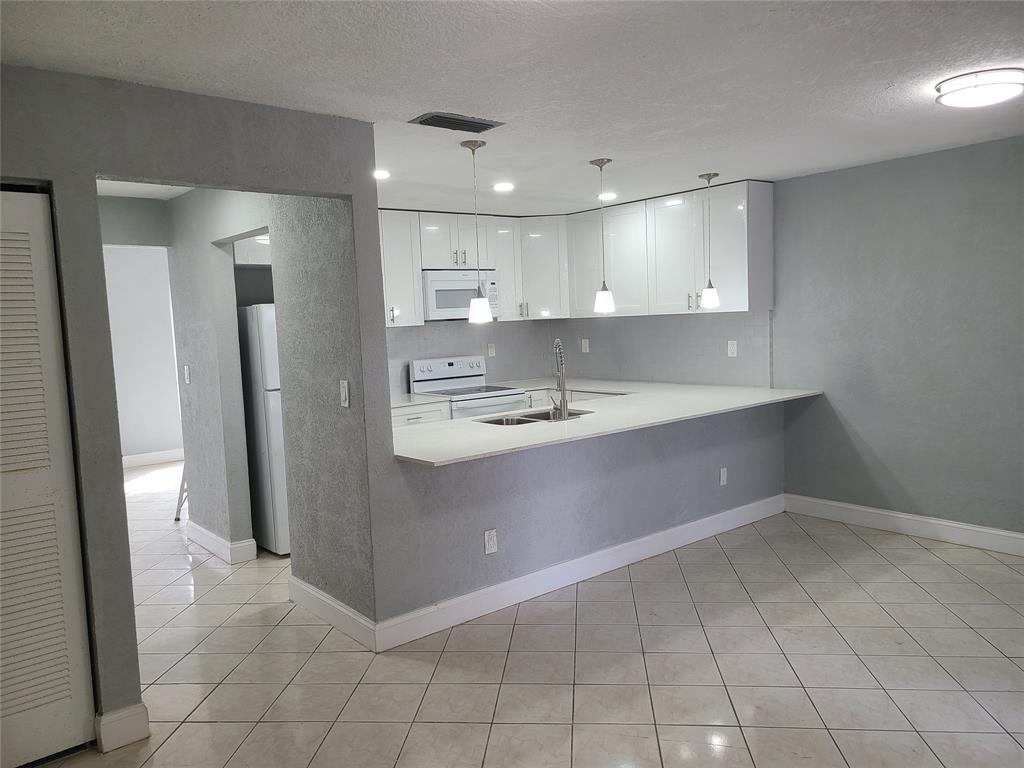2775 Northwest 194th Terrace Miami Gardens, FL 33056 - Photo 27 of 37 a bathroom with a sink a mirror and a shower