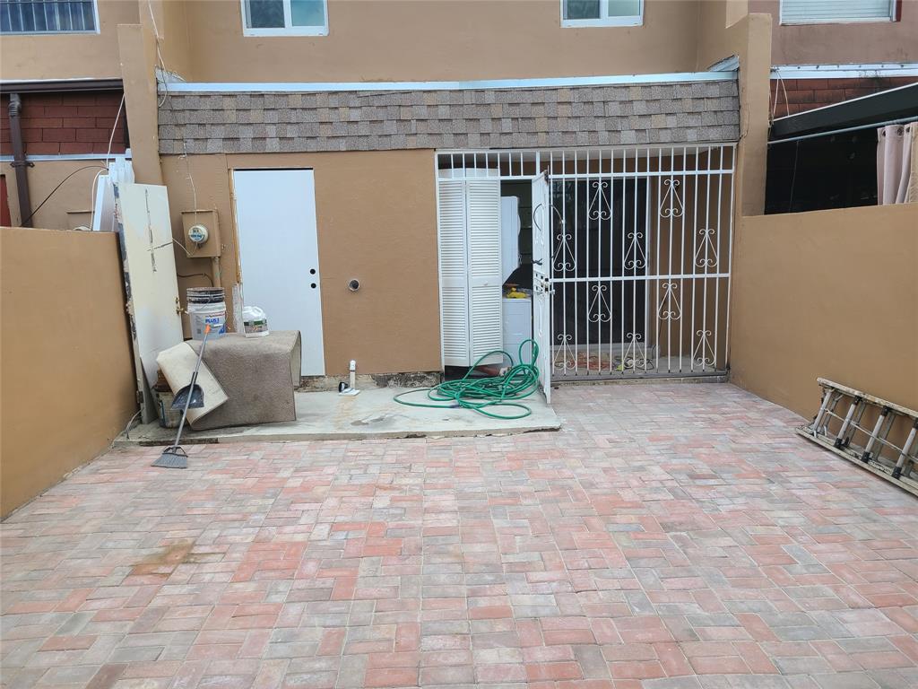2775 Northwest 194th Terrace Miami Gardens, FL 33056 - Photo 34 of 37 a view of backyard with wheel chair