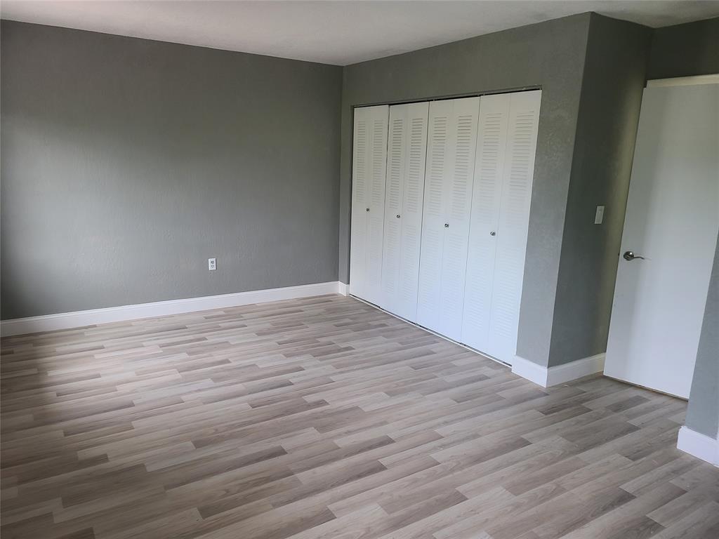 2775 Northwest 194th Terrace Miami Gardens, FL 33056 - Photo 9 of 37 a view of an empty room with wooden floor