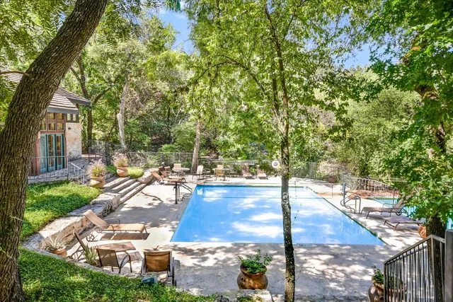 a view of a swimming pool with a patio