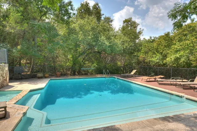 a view of a swimming pool with an outdoor space