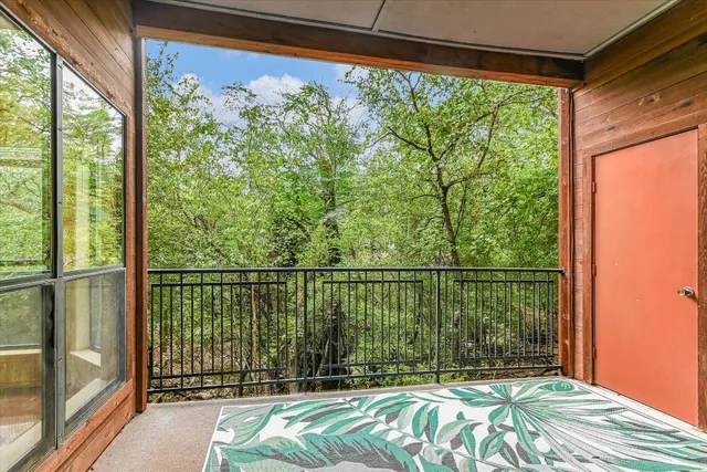 a view of a balcony with a bed