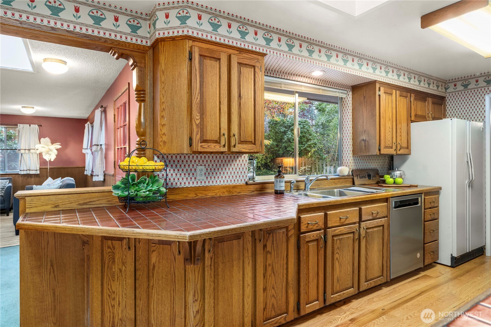 914 Alameda Avenue Fircrest, WA 98466 - Photo 13 of 40 a kitchen with stainless steel appliances a sink window and cabinets