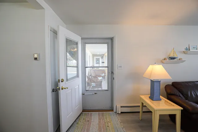 a view of a room that has a table and chair in it