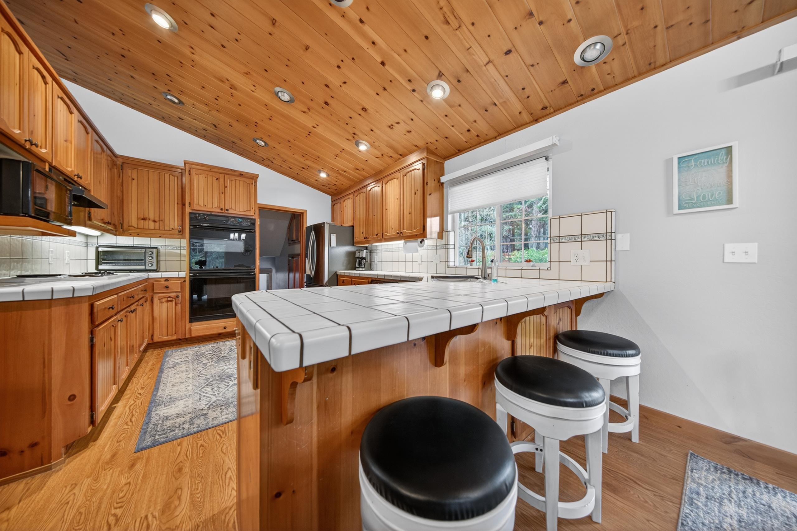 1220 Lynx Road Lake Almanor, CA 96137 - Photo 15 of 45 a kitchen with a stove and a refrigerator