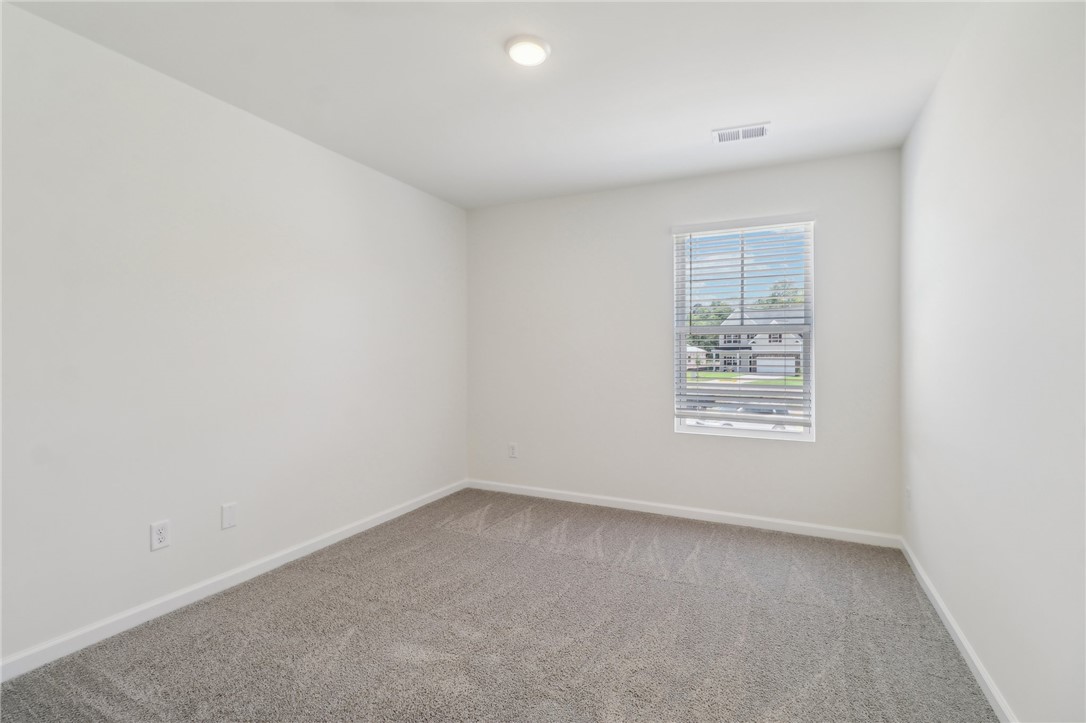 206 Bellflower Lane Pendleton, SC 29670 - Photo 11 of 27 This bright, blank canvas bedroom awaits your personal touch, offering comfort and serenity.