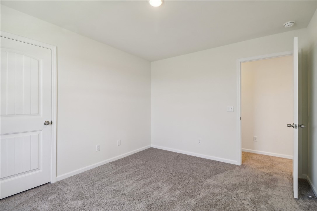206 Bellflower Lane Pendleton, SC 29670 - Photo 15 of 27 This spacious bedroom offers ample natural light and plush carpeting, ready for your personal touch.
