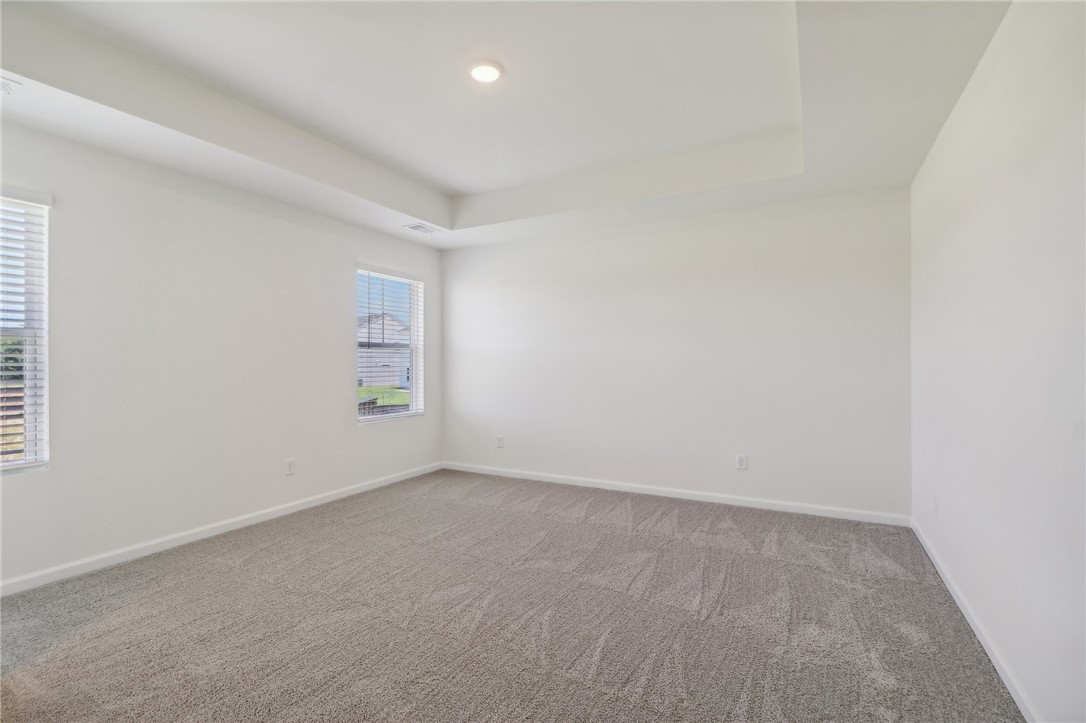 206 Bellflower Lane Pendleton, SC 29670 - Photo 17 of 27 This spacious room features vaulted ceilings and plush carpet, creating a serene and inviting atmosphere.