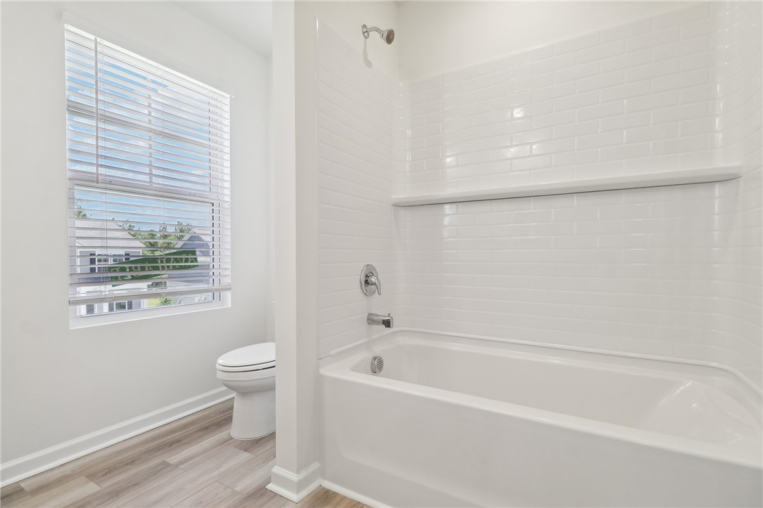 206 Bellflower Lane Pendleton, SC 29670 - Photo 22 of 27 This bathroom features a contemporary tub and shower combination with stylish subway tile surround.