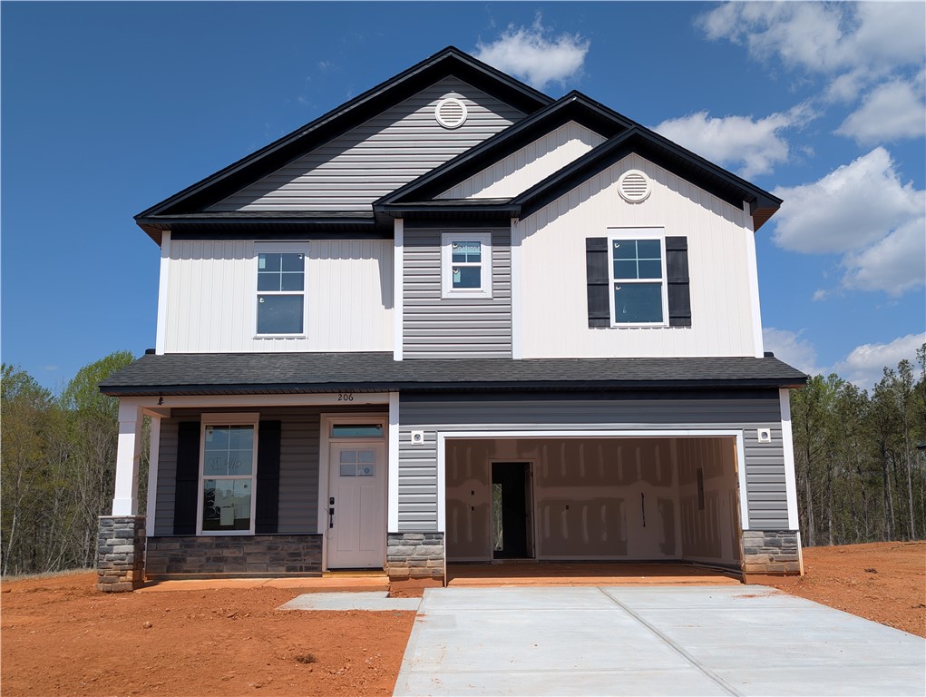 206 Bellflower Lane Pendleton, SC 29670 - Photo 25 of 27 This newly constructed residence showcases a welcoming facade with a covered entry and attached garage.