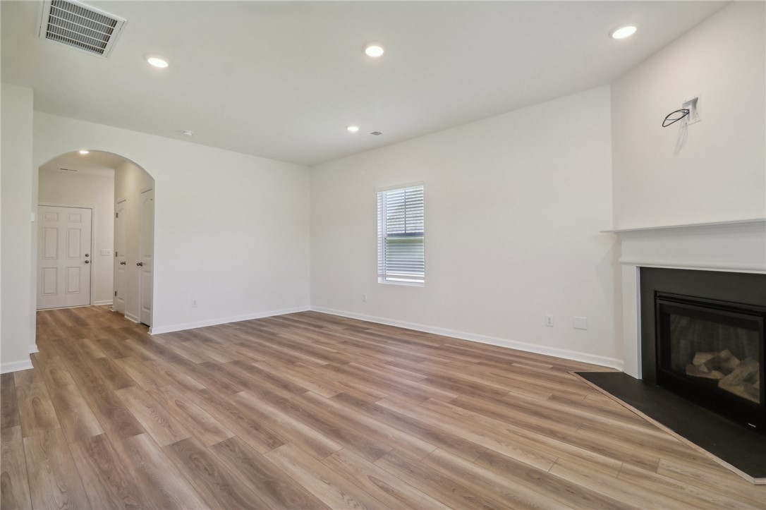 206 Bellflower Lane Pendleton, SC 29670 - Photo 5 of 27 This bright living space features clean lines and a cozy fireplace, perfect for relaxation and gatherings.