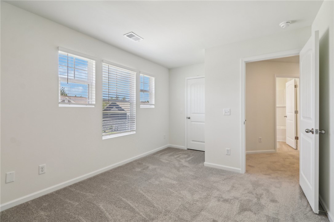 206 Bellflower Lane Pendleton, SC 29670 - Photo 9 of 27 This bright bedroom features a spacious layout, soft carpet, and abundant natural light.