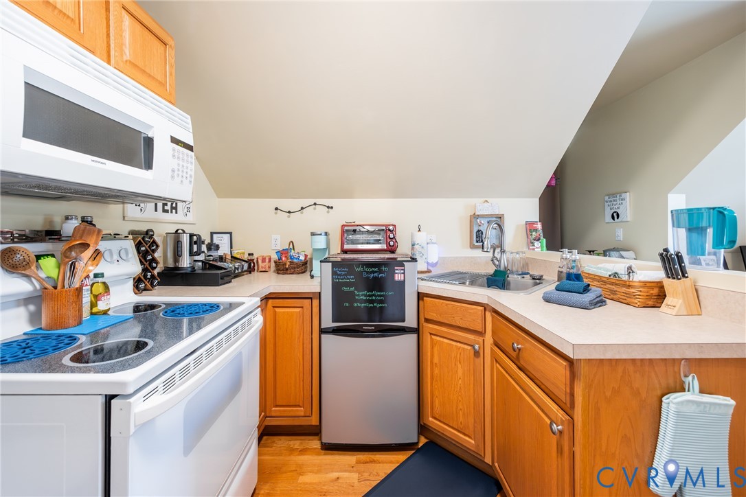 768 Hardtimes Road Farmville, VA 23901 - Photo 49 of 56 Compact kitchen featuring wood-finish cabinetry an