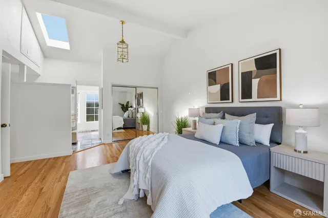 a bedroom with bed and window