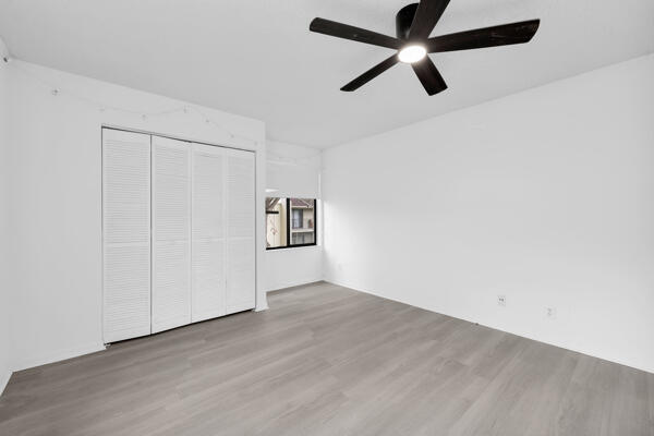 150 Pineview Road, Unit J6 Jupiter, FL 33469 - Photo 18 of 27 wooden floor in an empty room