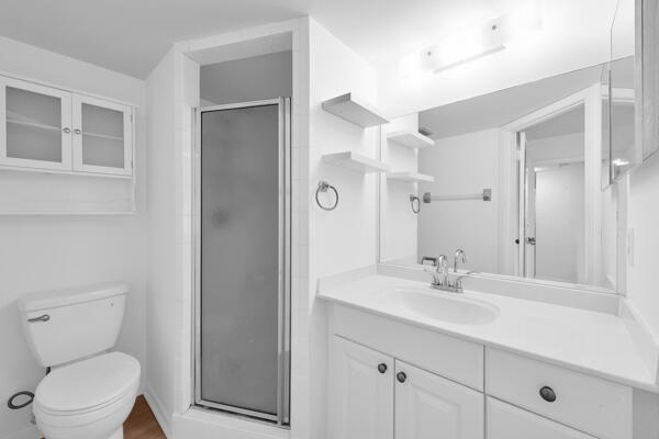 150 Pineview Road, Unit J6 Jupiter, FL 33469 - Photo 19 of 27 a bathroom with a toilet sink and mirror