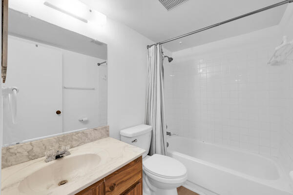 150 Pineview Road, Unit J6 Jupiter, FL 33469 - Photo 24 of 27 a bathroom with a sink toilet and shower