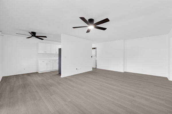 150 Pineview Road, Unit J6 Jupiter, FL 33469 - Photo 5 of 27 wooden floor in an empty room