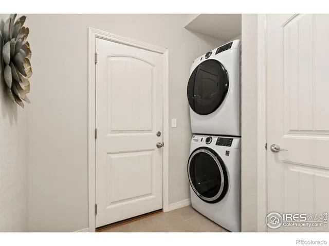 a view of a hallway with washer and dryer