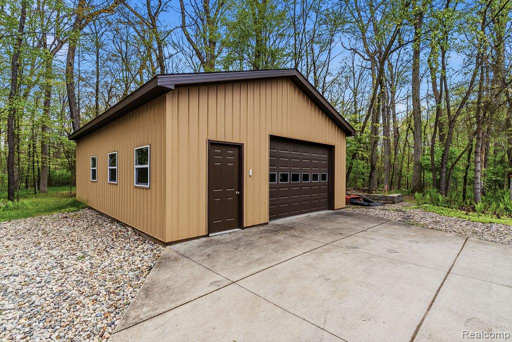 11111 Hibner Road Hartland, MI 48353 - Photo 43 of 59 Detached garage with driveway