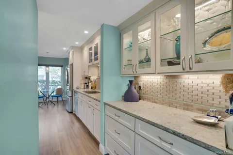 a kitchen with sink and cabinets