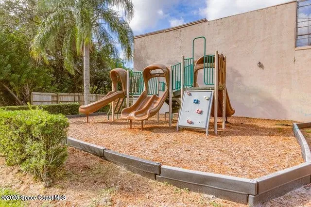 a room with gym equipment and a large window