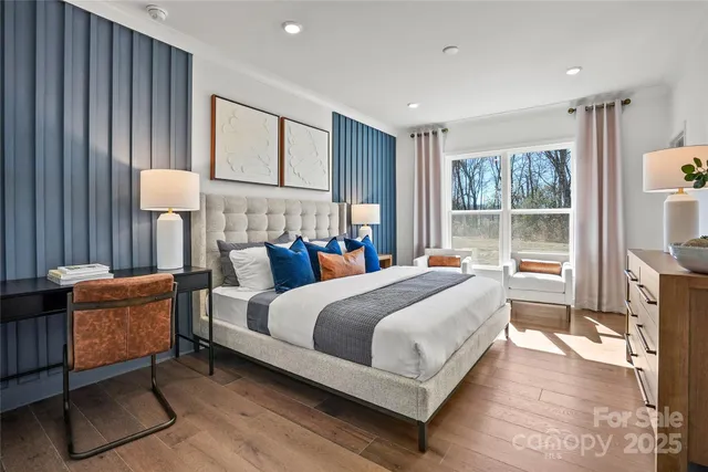 a bedroom with bed and window