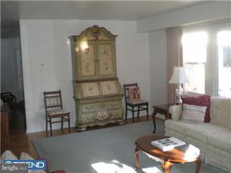 275 Bewley Road Haddonfield, NJ 08033 - Photo 3 of 11 a living room with furniture and a chandelier