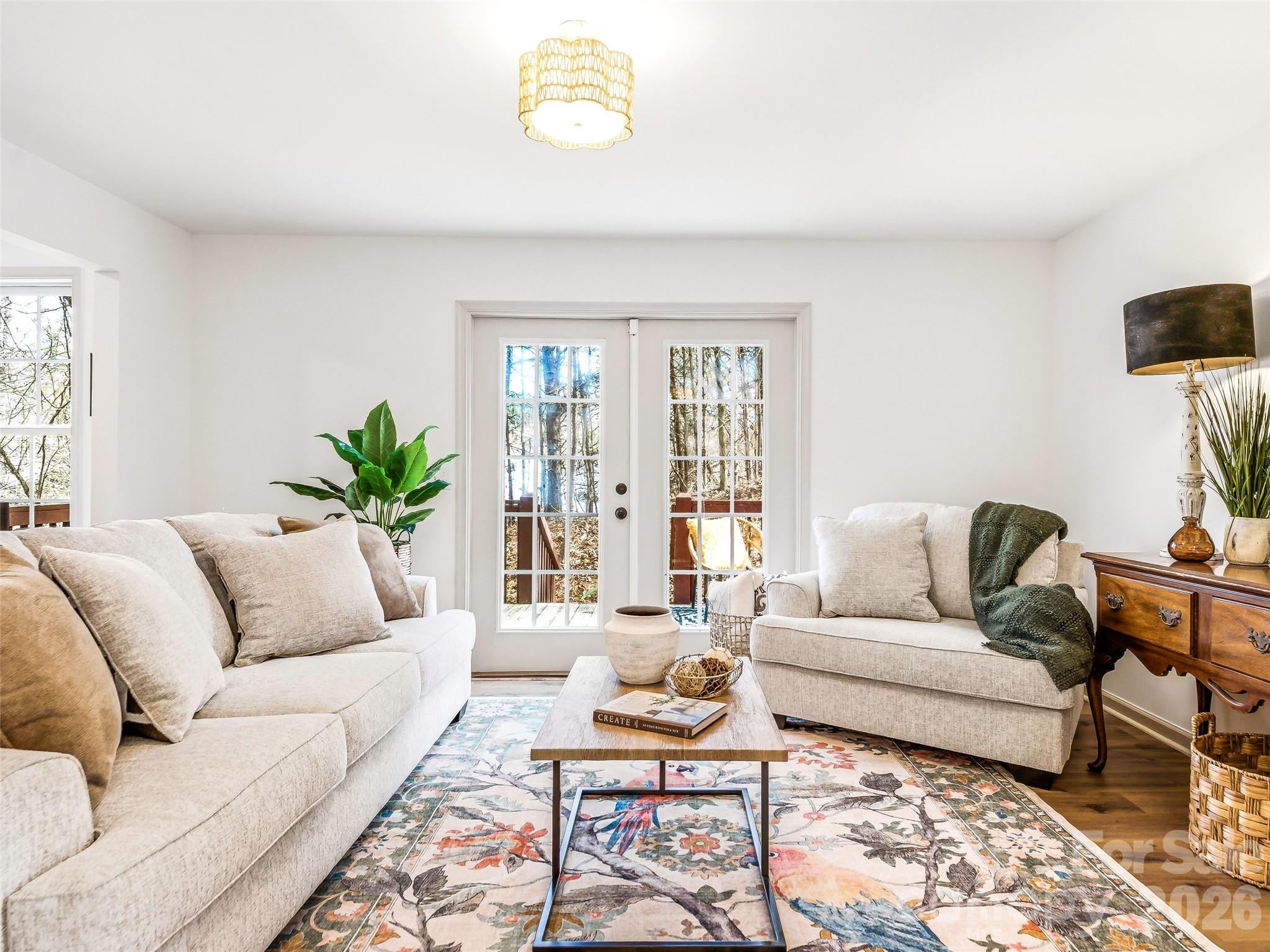 907 Gleason Street Arden, NC 28704 - Photo 12 of 41 a living room with furniture and a potted plant