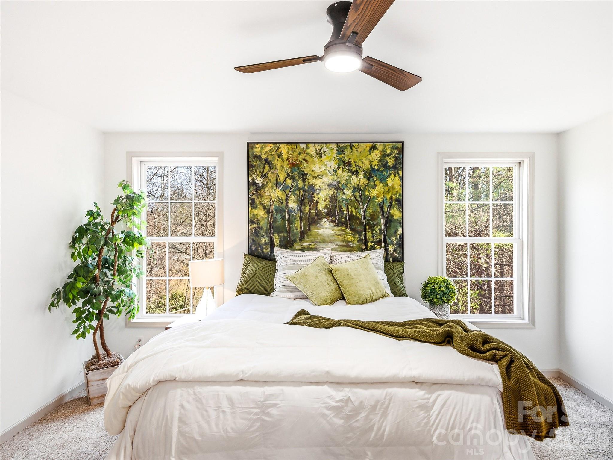 907 Gleason Street Arden, NC 28704 - Photo 23 of 41 a bedroom with a large bed and a large window