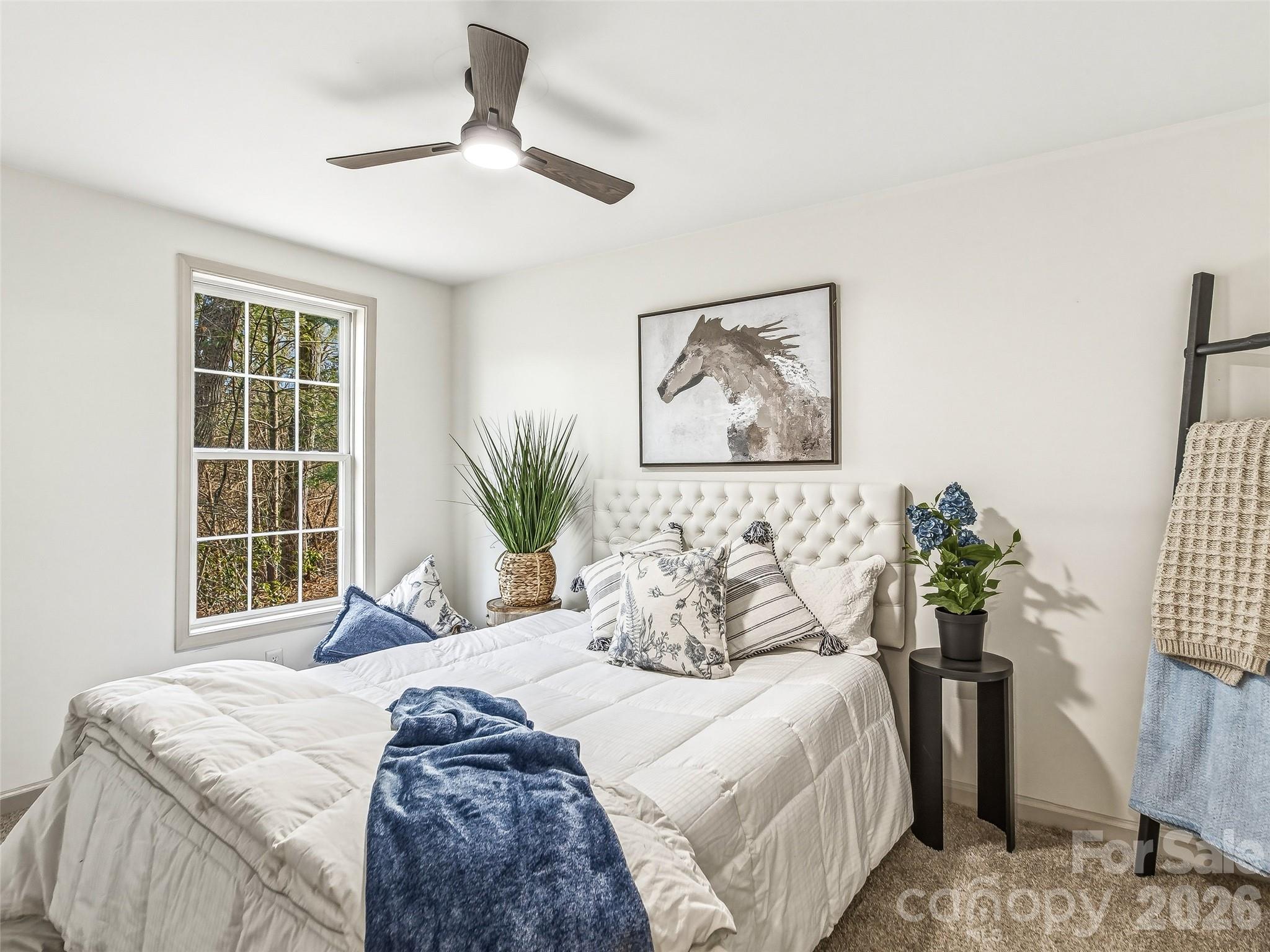 907 Gleason Street Arden, NC 28704 - Photo 28 of 41 a bedroom with a bed and a window