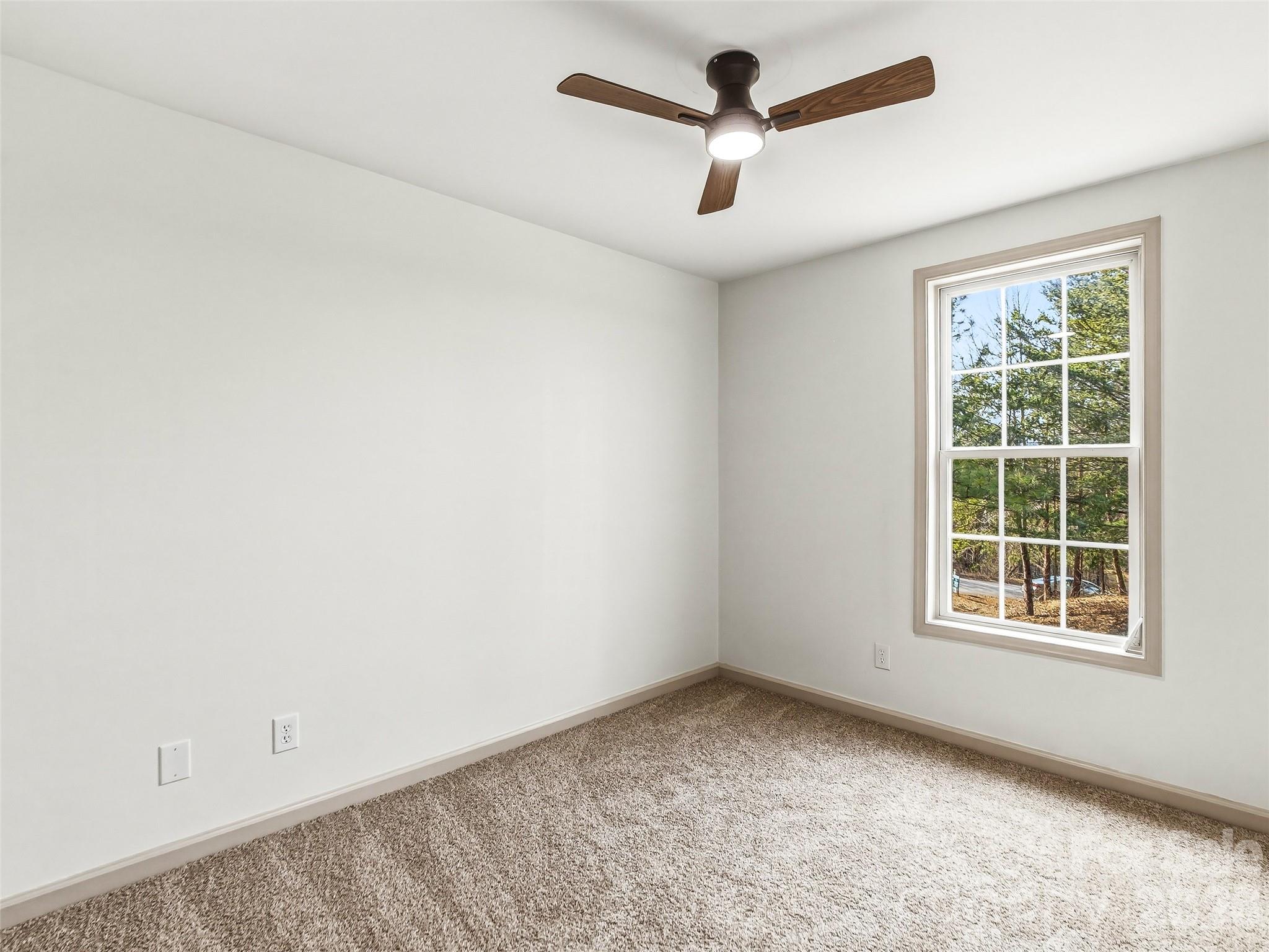 907 Gleason Street Arden, NC 28704 - Photo 32 of 41 an empty room with a window
