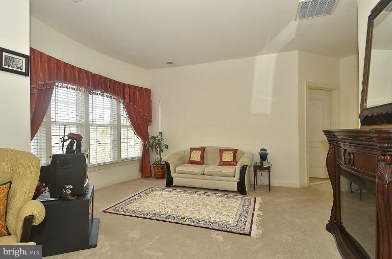 505 Great Falls Road Rockville, MD 20850 - Photo 2 of 30 a living room with furniture fireplace and flat screen tv