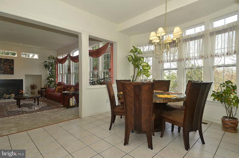 505 Great Falls Road Rockville, MD 20850 - Photo 11 of 30 a view of a dining room with furniture and chandelier