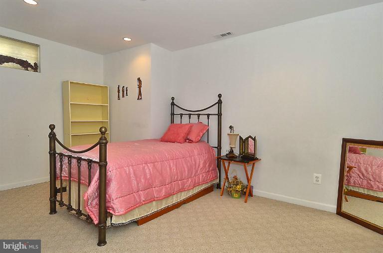 505 Great Falls Road Rockville, MD 20850 - Photo 14 of 30 a bedroom with bed and night stand
