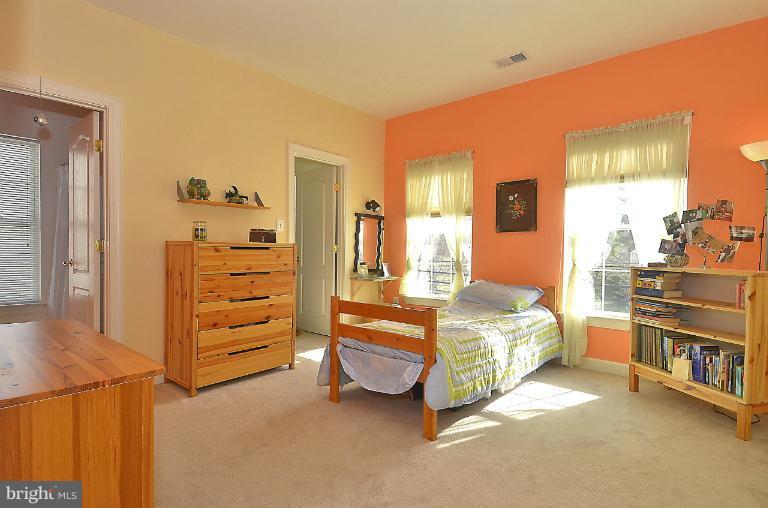 505 Great Falls Road Rockville, MD 20850 - Photo 16 of 30 a bedroom with a bed and a cabinets